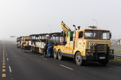 Burnt buses are removed from the N2 and Borcherds Quarry intersection. A taxi strike in Cape Town  began on Thursday August 3, 2023.