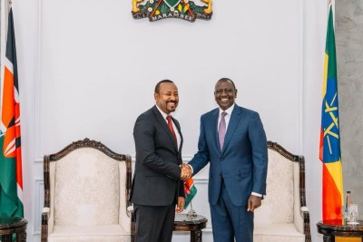 Ethiopia's Prime Minister Abiy Ahmed (L) and Kenya's President William Ruto shakes hands at state house Nairobi, Kenya on February 28, 2024.